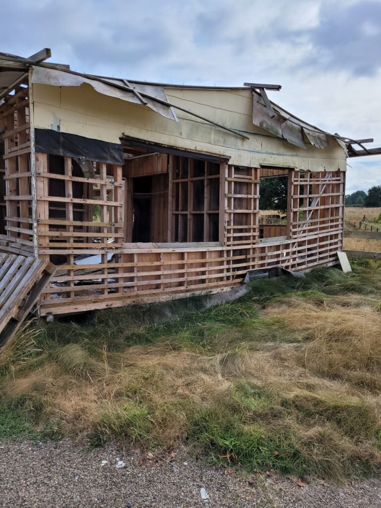 Residential house prepared for demolition after safe asbestos cladding removal by Hazard Pro specialists.
